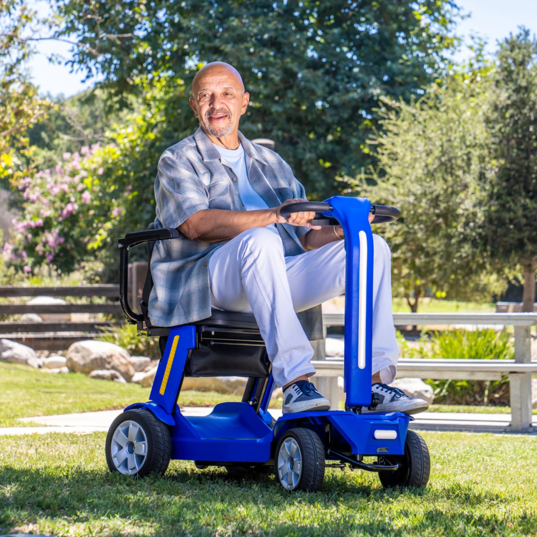 Man riding the Reyhee Flex (RF01) Electric Folding Mobility Scooter in blue