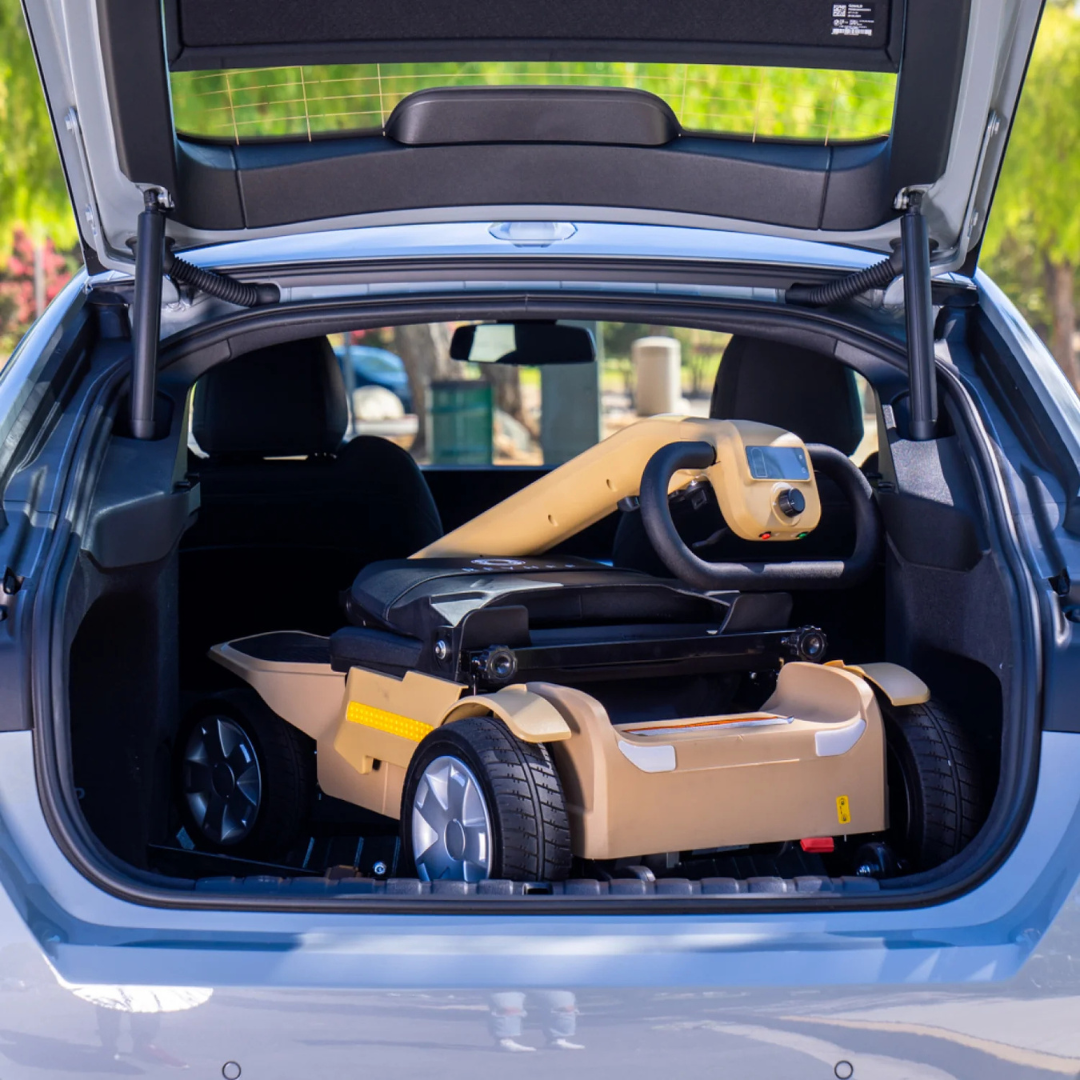 The Reyhee Flex (RF01) Electric Folding Mobility Scooter folded in the back of a car