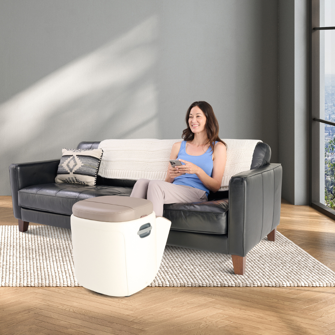 woman using Human Touch Reveal Ottoman Massager