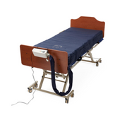 The Medline A10 LAL / Alternating Pressure Mattress System in a bed