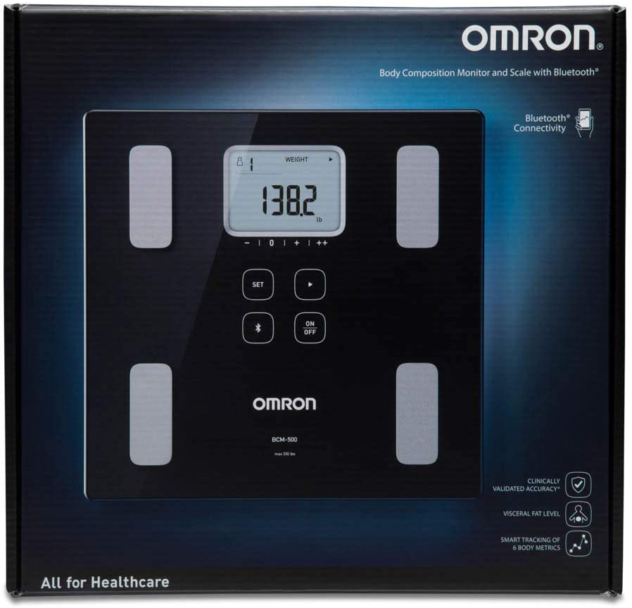 a person having a free checkup using an OMRON hand held body fat